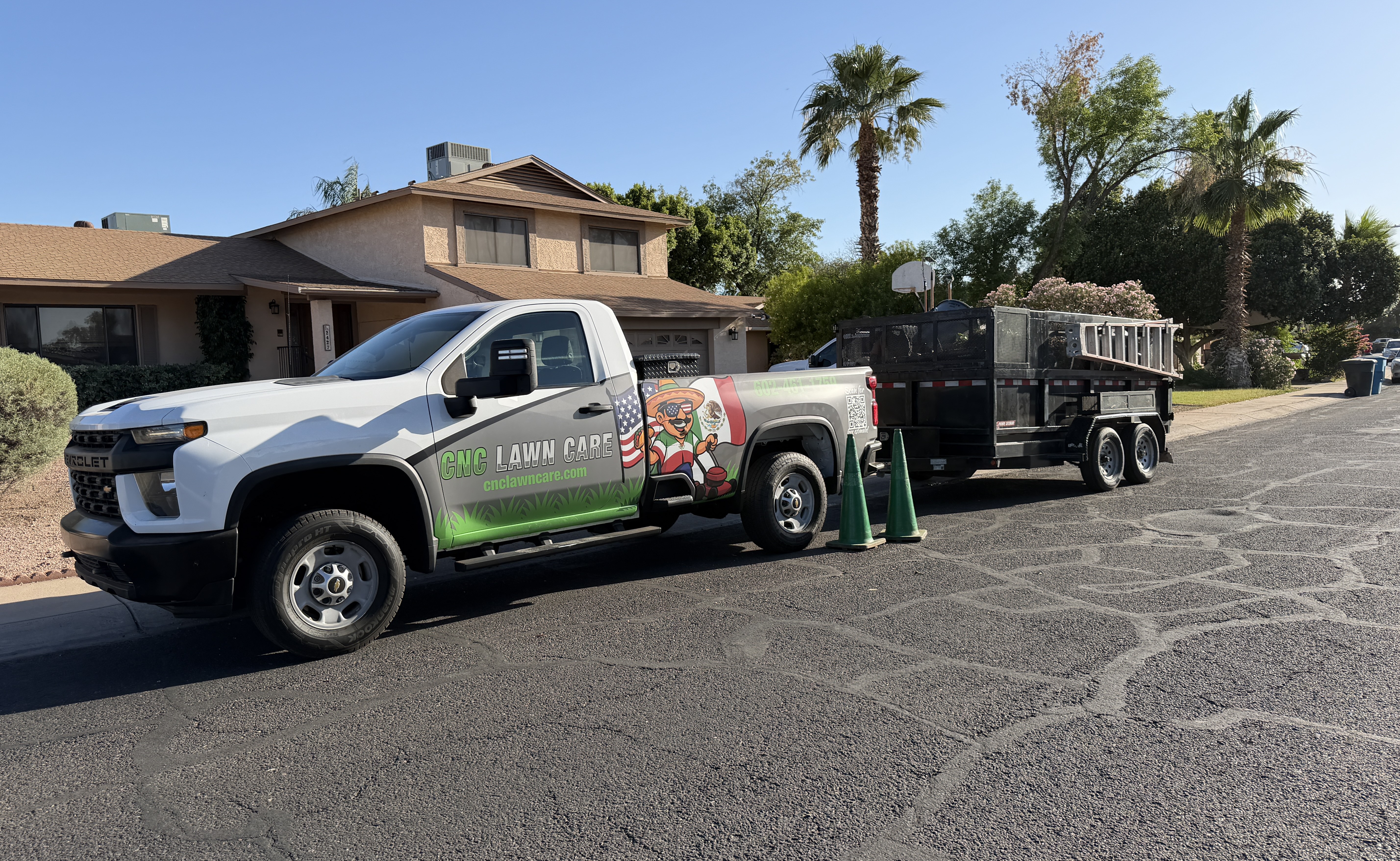 CNC Lawncare — wrapped truck and trailer on job in Surprise AZ